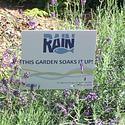 The sign indicates that this garden has been designed to absorb rain and minimize runoff. 