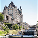 The historic Chateau Laurier Hotel above the Rideau Canal locks.  Photo credit:  the Canadian Trade Commission. 