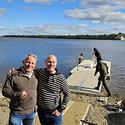 Mike Duggan and John Savage pose in front of the new canoe launch for Pointe-Gatineau.