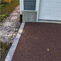Driveway and walkway finished with permeable surface material to mitigate stormwater run-off.