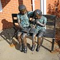 Bronze sculpture of young readers at the Manotick Public Library